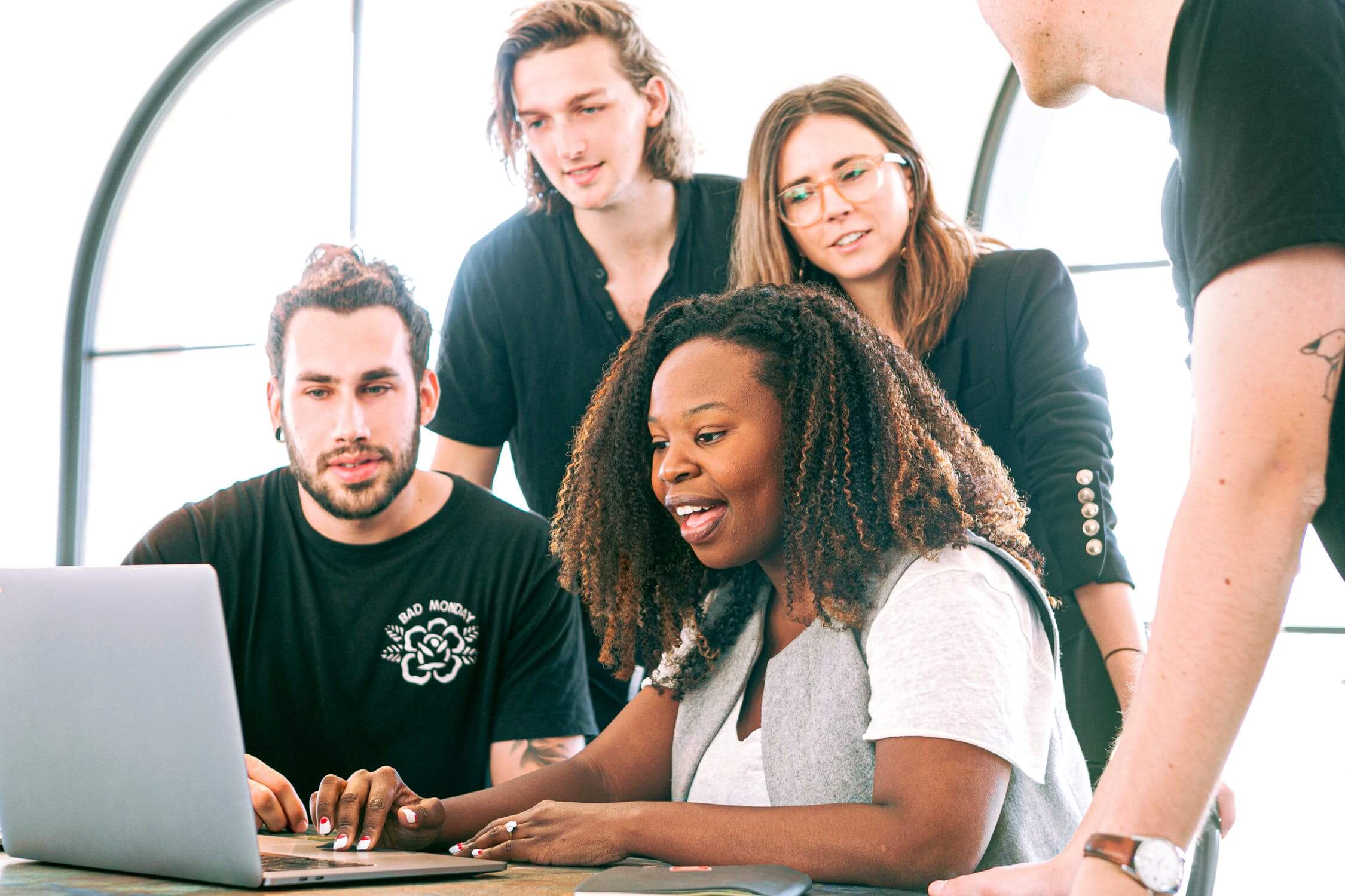 digital marketing team working together on a laptop